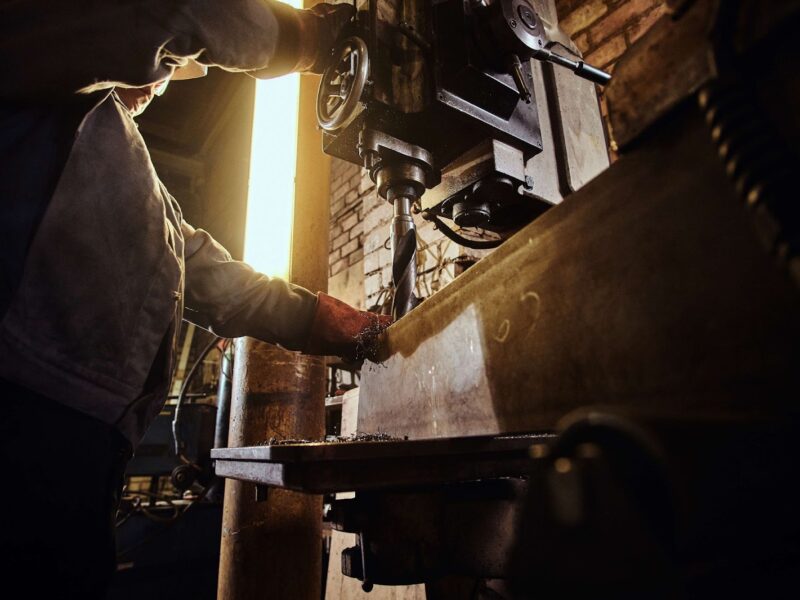 A man works at a lathe
